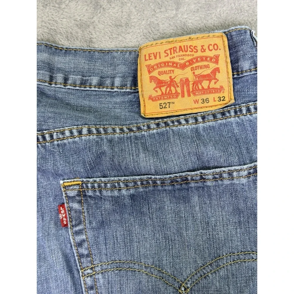 Levis‎ 527 Jeans Mens 36x32 Blue Medium Wash Distressed Denim Low Bootcut Cowboy